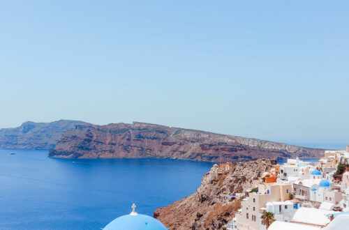 View for caldera in Santorini with white houses and blue domes