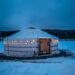 Yurt with lights and river on the back