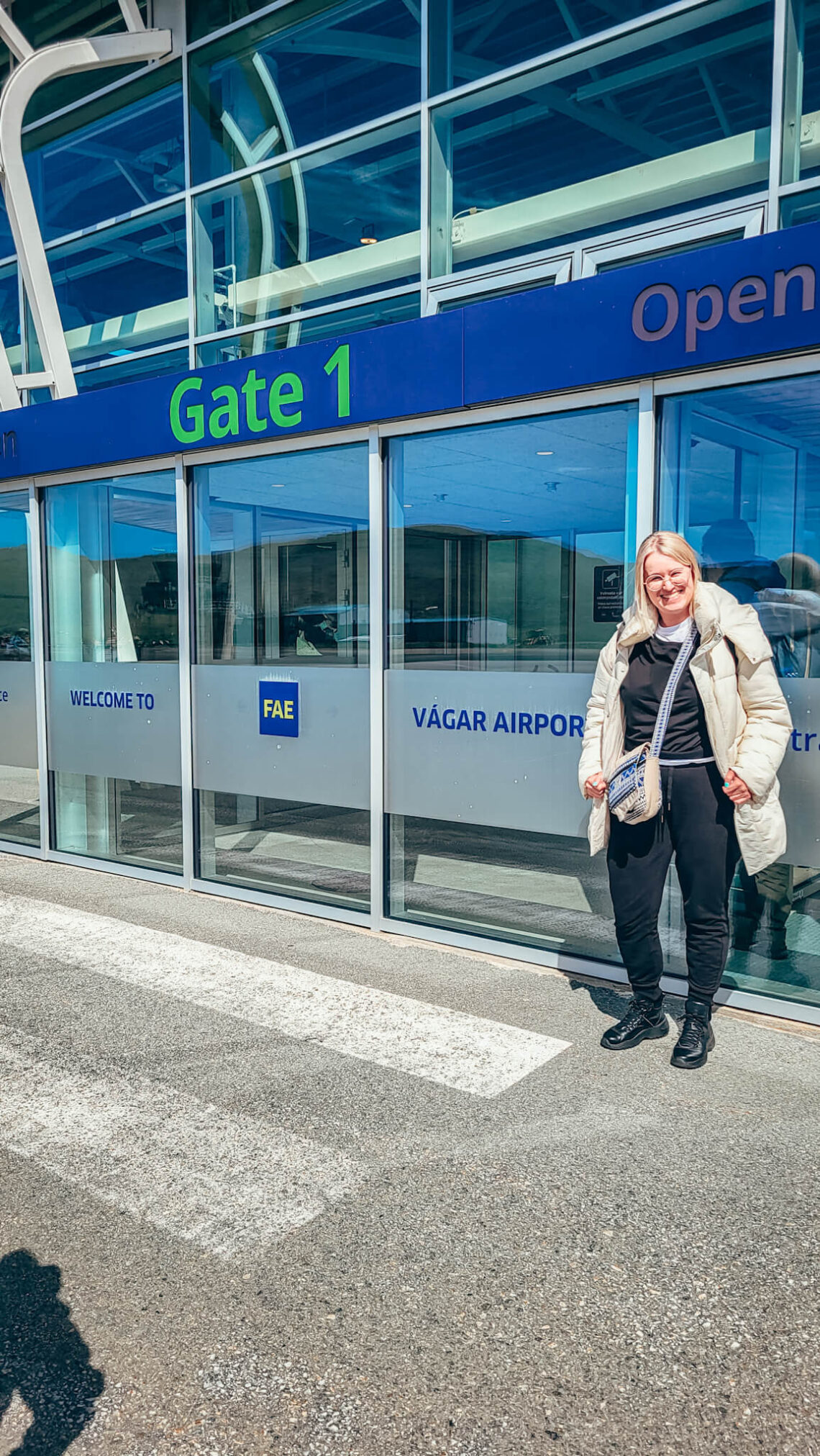 Aleksandra standing and smiling at the entry to Vagar terminal